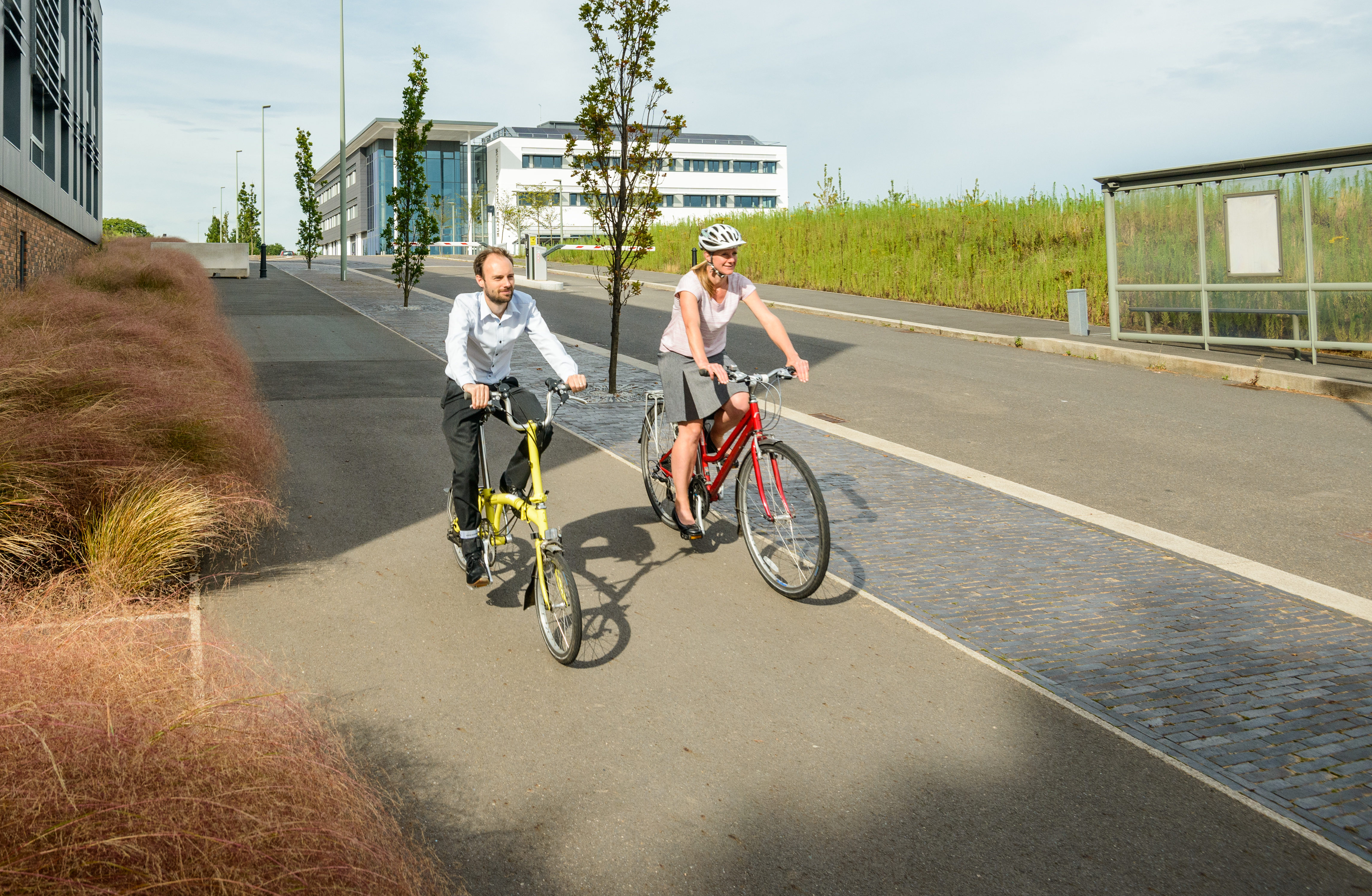 Man and a woman cycling at the Exeter Science Park